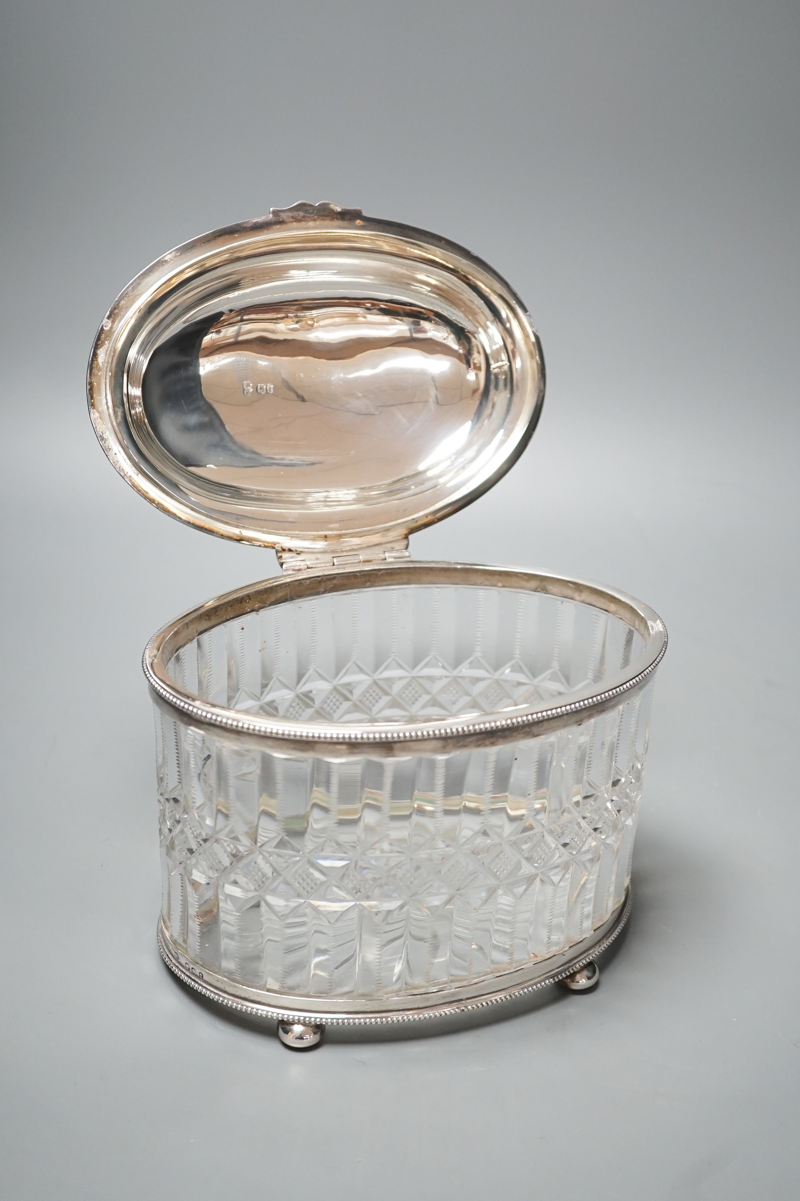 A Victorian engraved silver mounted cut glass oval biscuit barrel, double stamped maker's mark, London, 1874, height 15.5cm.